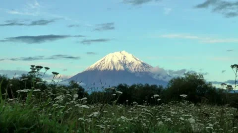 Autumn, evening, cold, a volcano in sunset beams, zoom in 스톡 동영상 10605591