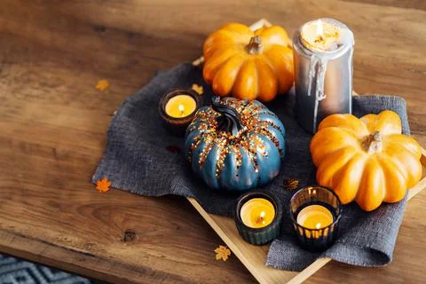 Autumn, fall cozy mood composition for hygge home decor. Decorative orange and Stock Photos