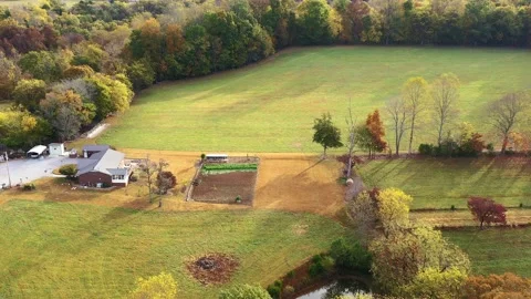 Autumn, fall yellow, orange red colorful trees forest and a Farm house, barn, Stock Footage 219300085