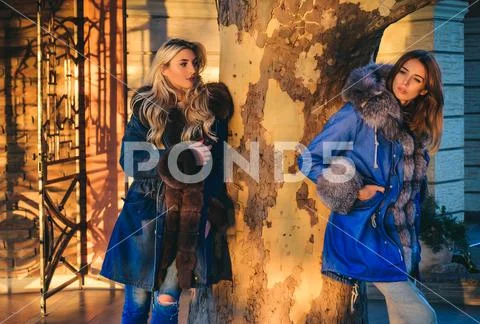 Autumn fashion trend. Fashion outdoor photo of gorgeous sensual models in Stock Photos