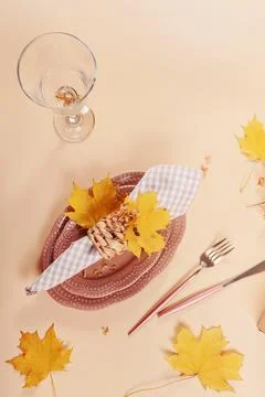 Autumn festive table setting on beige background Stock Photos