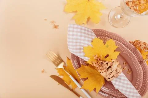 Autumn festive table setting on beige background Stock-Fotos