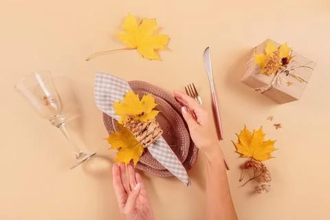 Autumn festive table setting on beige background Foto stock