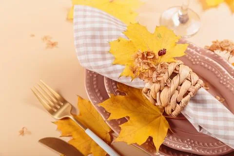 Autumn festive table setting on beige background Stock Photos