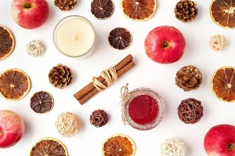 Autumn flat lay composition of apples, fall foods and decor on white background Stock Photos