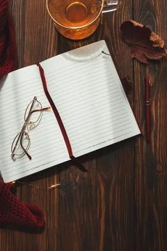 Autumn flat lay with open notebook, cup of tea Stock Photos
