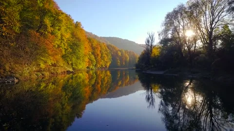 Autumn flight over the river 스톡 동영상 64013412