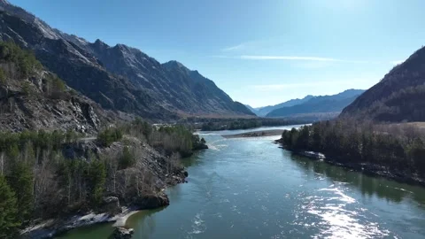 Autumn flight over the turquoise river and mountains Stockbeeldmateriaal 255217677