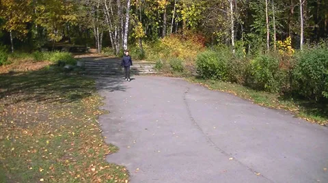 Autumn in the forest - Boy dancing walking in the park Stock Footage 67852010