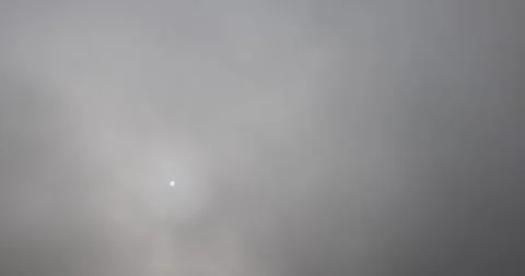 Autumn gray sky with thick clouds and thick fog that slowly dissipates from Stock Footage 320374541