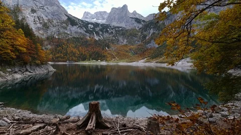 Autumn Hinterer Gosausee lake, Upper Austria. Dachstein summit and glacier far Stock Footage 125345052