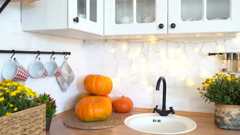 Autumn kitchen interior with pumpkin, fallen leaves Stock Footage 139710253