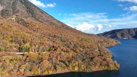 Autumn Lakeshore | Mountain Road | Nikko - 4K Aerial Video Stock Footage 329052681