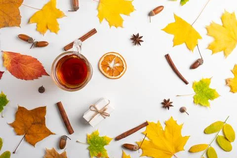 Autumn leaves pattern with a cup of coffee or tea on a white background.flat  Stock Photos