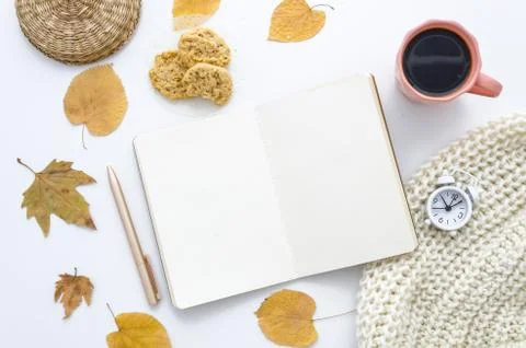Autumn mockup with empty notebook, dry leaves, scarf and coffee. Flat lay, top Stock Photos