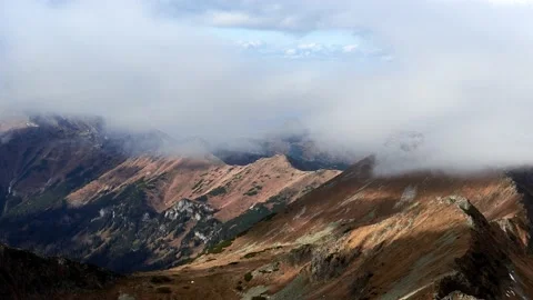 Autumn mountain landscape, clouds pass over the mountain ridge. Light and shadow Video stock 221711534