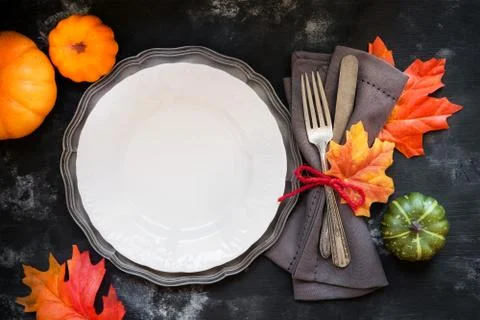 Autumn or Fall table place setting with vintage silverware decorated with aut Stock Photos