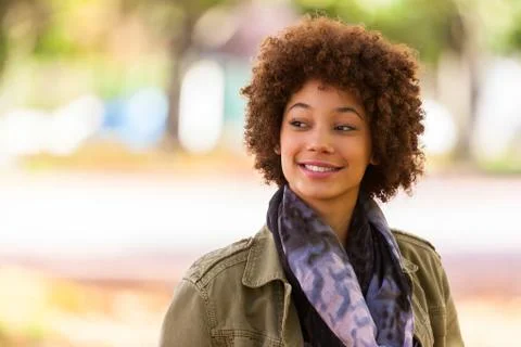 Autumn outdoor portrait of beautiful african american young woman - black peo Stock Photos