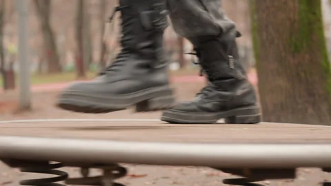 Autumn park setting with rhythmic steps and leather footwear. Detailed scene Stock Footage 345528518