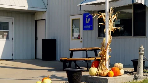 Autumn pumpkin and corn stalk display outside a building in Lebanon Video stock 345530598