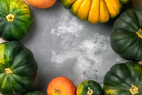 Autumn Pumpkin seasonal composition with green, orange and yellow vegetables. Stock Photos