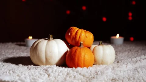 Autumn pumpkins with candles in warm background Stock Footage 257596144