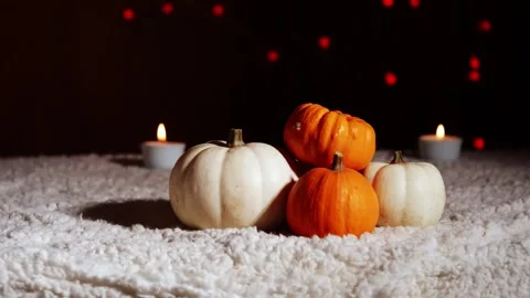 Autumn pumpkins with candles in warm background Stock Footage 258227235
