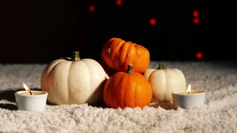 Autumn pumpkins with candles in warm background Stock Footage 258366516