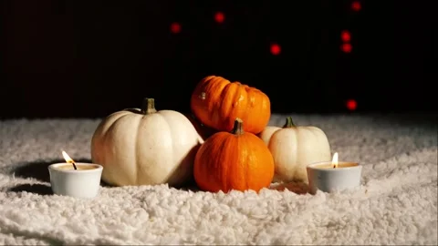 Autumn pumpkins with candles in warm background Stock Footage 258476820