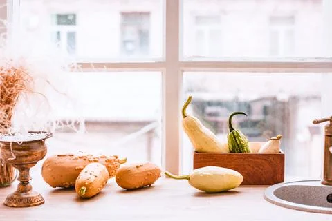 Autumn pumpkins on a kitchen table Stock Photos
