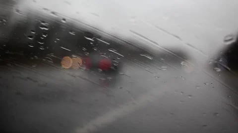 Autumn rain on windshield window with road background Stock Footage 142329301