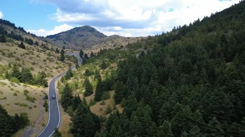 Autumn Road Through Valley With Distant Mountain Summit Under Shadows Stock Footage 325221074