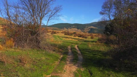 Autumn Rural Path Through Fields and Mountains Stock Footage 293151303