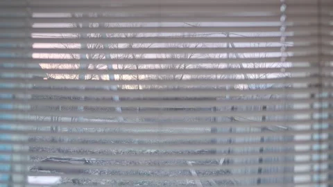 Autumn rustic sunset outside the window through the blinds Stock Footage 168940003