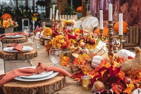 Autumn rustic table setting decorated with pumpkins and autumn leaves for cel Stock Photos