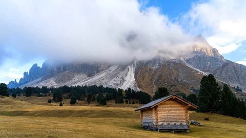 Autumn scene with dramatic cloudscape during sunset in Italian Dolomites. Stock Footage 98623098