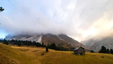 Autumn scene with dramatic cloudscape during sunset in Italian Dolomites. Video stock 98623155