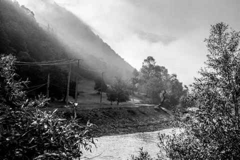 Autumn scene with dramatic light on the Olt River. Monochrome Stock Photos