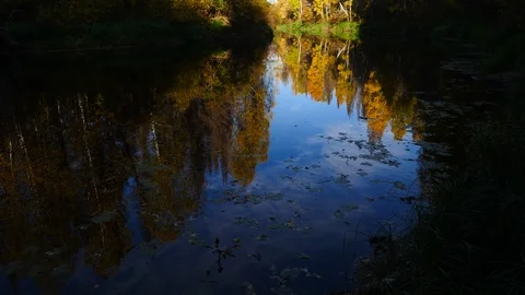 Autumn sky is reflected in a quiet river Stock Footage 96745174
