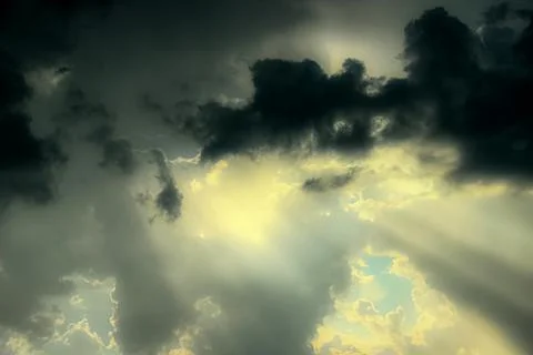 Autumn sky with sun rays through light and soft clouds. Stock Photos