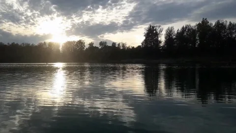 Autumn. Soft sunset. The reflection of the sun in the lake. Video stock 98465018