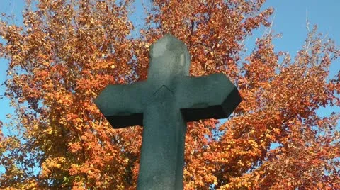 Autumn stone cross gravestone Stock Footage 11024399