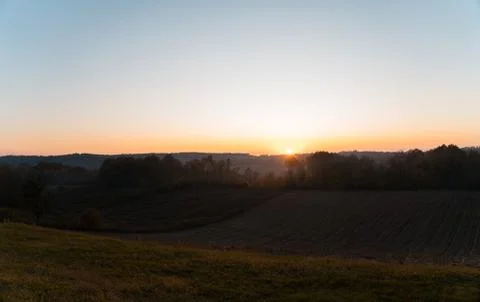 Autumn sunset over fields Stock Photos