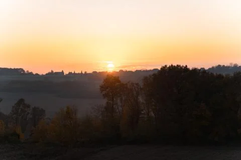 Autumn sunset over fields Stock Photos