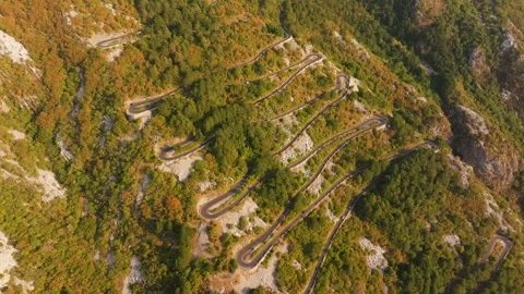 Autumn Switchback Patterns on Kotor Serpentine Mountain Road, Aerial Flyover Stock Footage 345838921