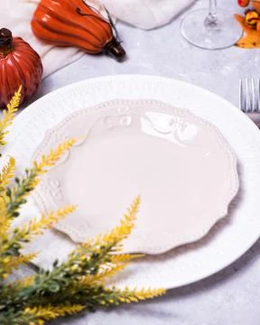 Autumn table setting with a brown craft paper card. Stock Photos