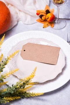 Autumn table setting with a brown craft paper card Stock Photos