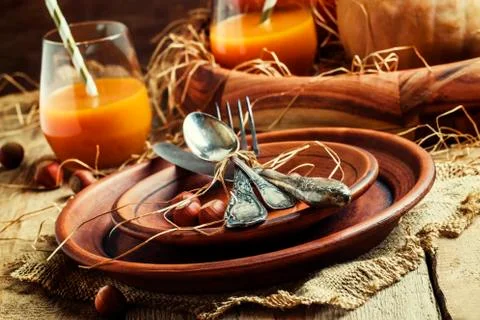 Autumn table setting with earthenware, vintage wooden background, selective f Stock Photos
