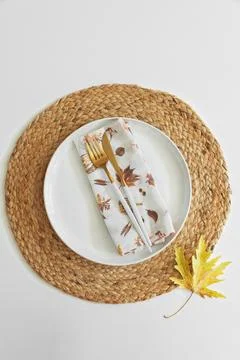 Autumn table setting on placemat with leaf napkin Stock Photos