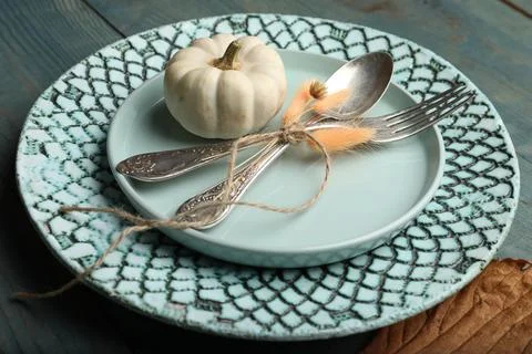 Autumn table setting with pumpkin on blue wooden background, closeup Stock Photos